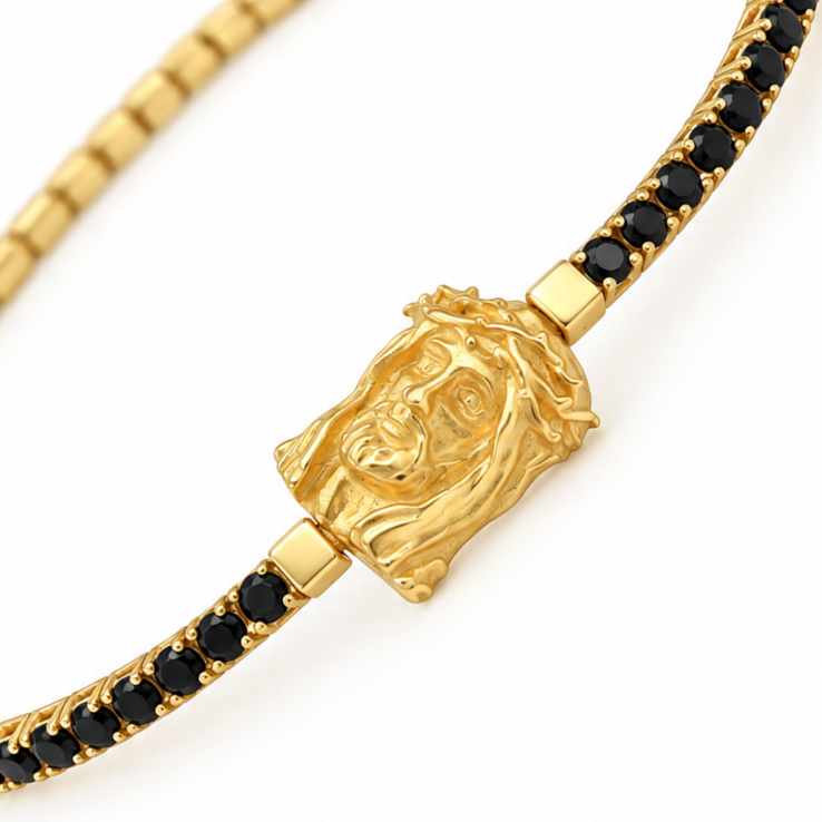 "Bracciale da uomo in oro giallo 18KT con medaglione di Cristo e zirconi neri, peso 6,86 gr, lunghezza 20 cm, Made in Italy Gilma Gioielleria."